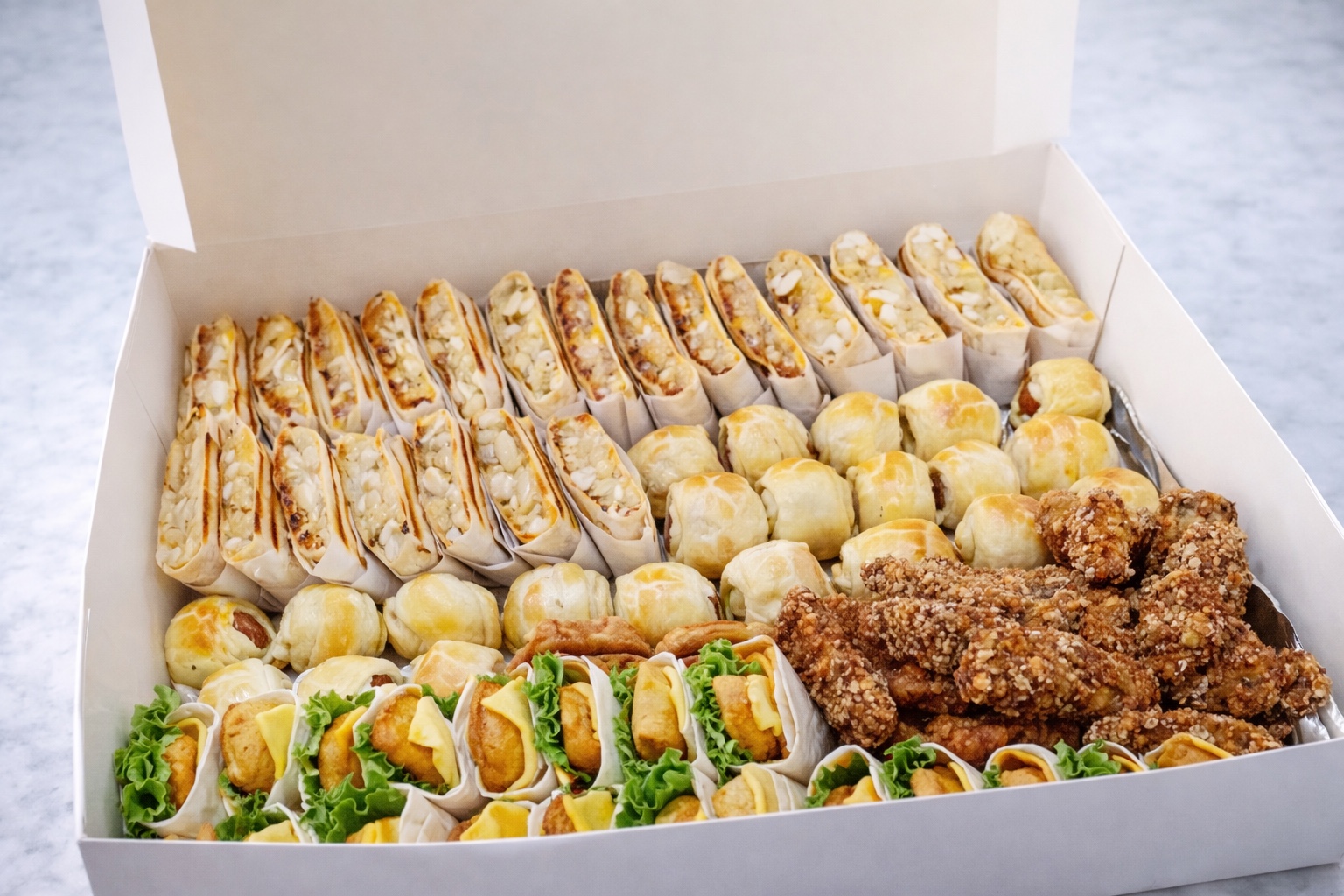 Fresh party box with sandwiches and savory bites